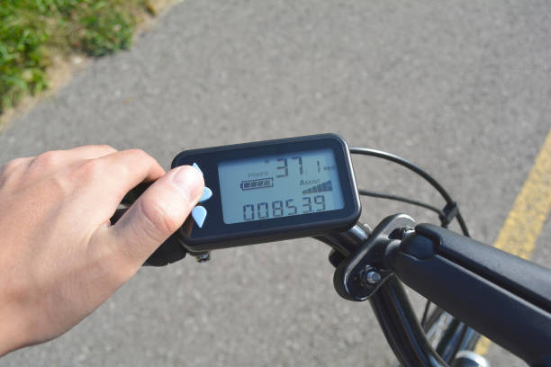 istock A male hand presses a button on a black electronic bicycle scooter. Bike computer installed on a bicycle's handlebar. Man pressing a button on e-bike control board. 913879856
