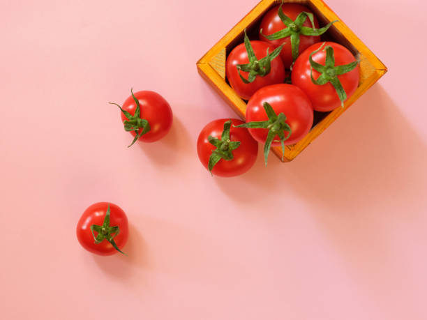 istock Tomatoes spilling out from wooden case 913880774