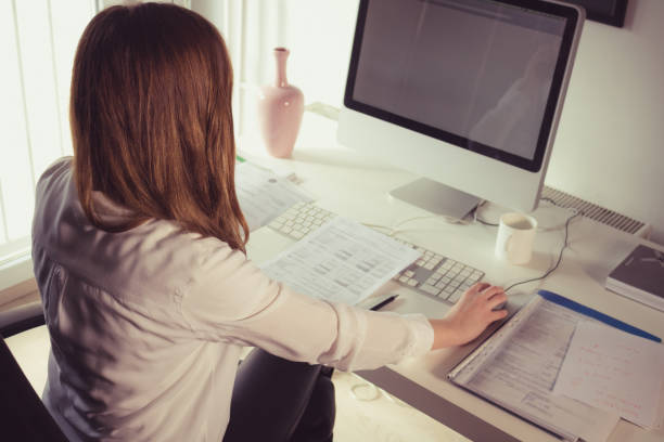 istock Businesswoman sitting in her office and working on desktop PC. 913882828