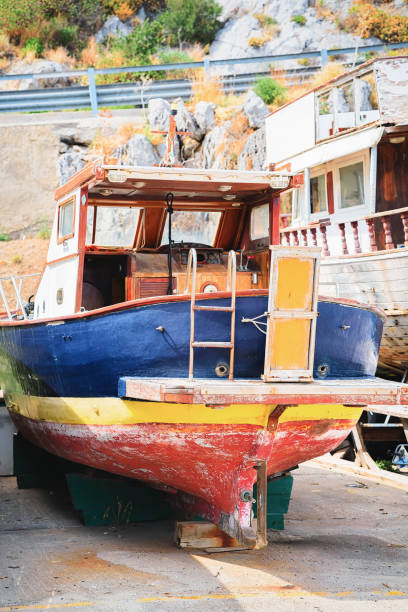 istock Old boat in Cefalu port Sicily 913882968