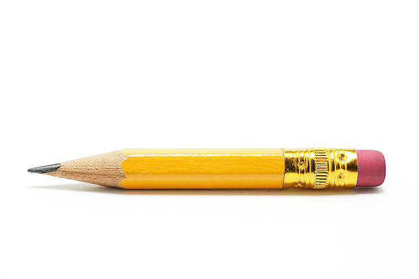 Close-up of very short yellow pencil on white background Short Pencil on White Background short stature stock pictures, royalty-free photos & images