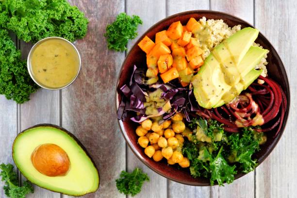 istock Healthy Buddha bowl on wood background, overhead scene 913903616