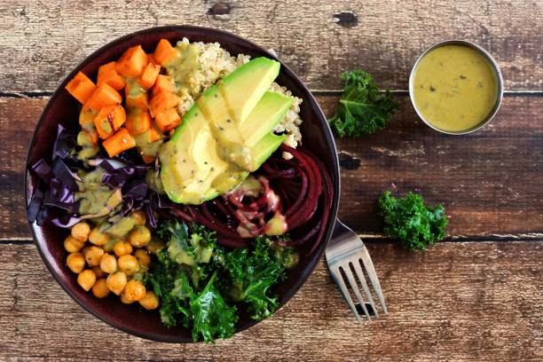 istock Healthy Buddha bowl on a wood background. Top view. 913903728
