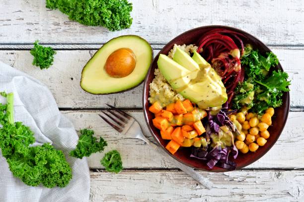 istock Healthy Buddha bowl on white wood. Top view scene. 913903844