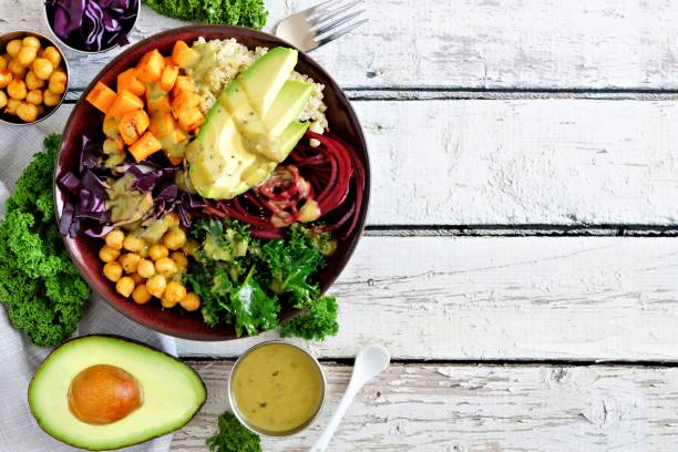 istock Healthy eating Buddha bowl on white wood. Top view, side border with copy space. 913903874