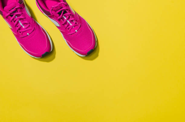 istock Fitness accessories on yellow background mock up, top view 913935418