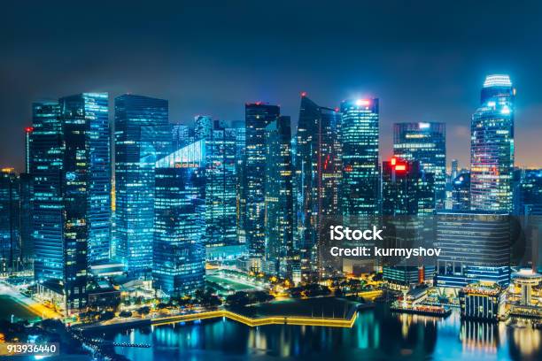 Singapore City Skyline Business District Aerial View Downtown Landscape Reflected In Water At Night In Marina Bay Travel Cityscape Stock Photo - Download Image Now