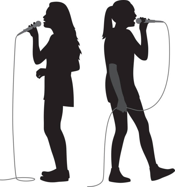 Girls Singing into Mic Silhouettes Vector silhouettes of two girls singing into microphones. pep rally stock illustrations