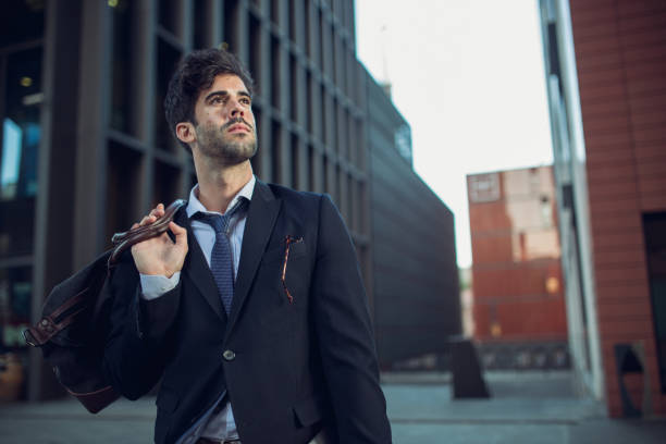 istock Young businessman with luggage bag 913946712