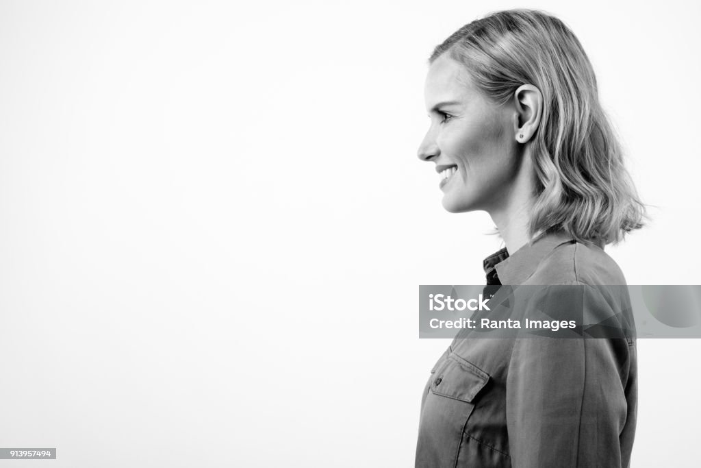 Portrait Of Beautiful Happy Blonde Woman Against White Background Studio Shot Of Beautiful Blonde Woman Against White Background Black And White Stock Photo