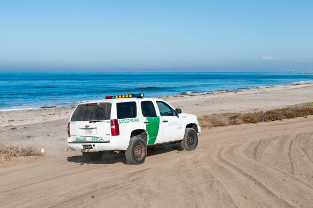 Border Patrol Vehicle Patrols Beach at Border Field State Park in San Diego stock photo