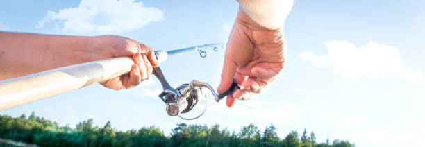 A man is fishing by spinning.The capture of fish.
