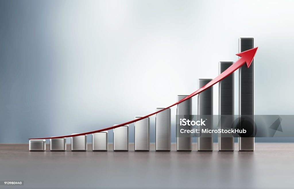 Financial Growth Bar On Wood Surface Against Defocused Background Metallic financial growth bar and a red arrow on wood background. Growth concept. Horizontal composition with selective focus and copy space. Chart Stock Photo