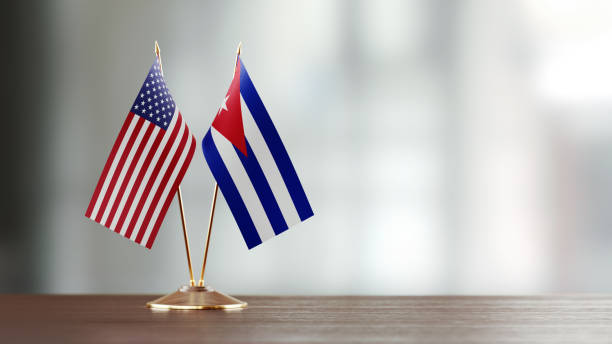 istock American And Cuban Flag Pair On A Desk Over Defocused Background 913980682