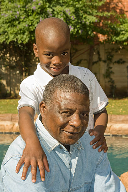 istock African child embracing his father 91398215