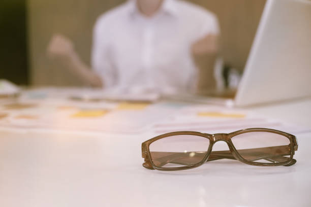 istock Glasses on business office table,Business success concept. 913987430