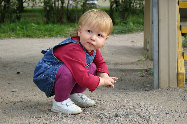 istock Beautiful baby girl playing with sand 91399306