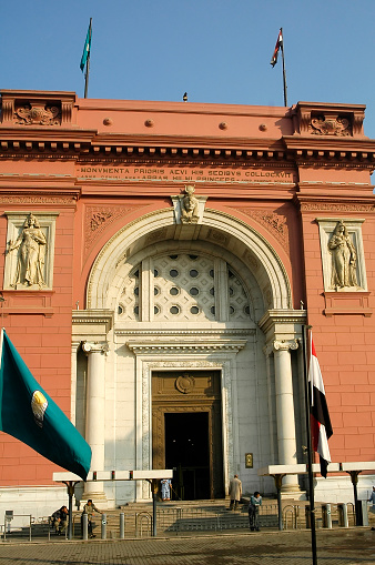 Cairo, Egypt - November 11, 2006: The Egyptian Museum in Cairo, one of the most famous museums of the world. Tourists come through the main entrance into the museum.