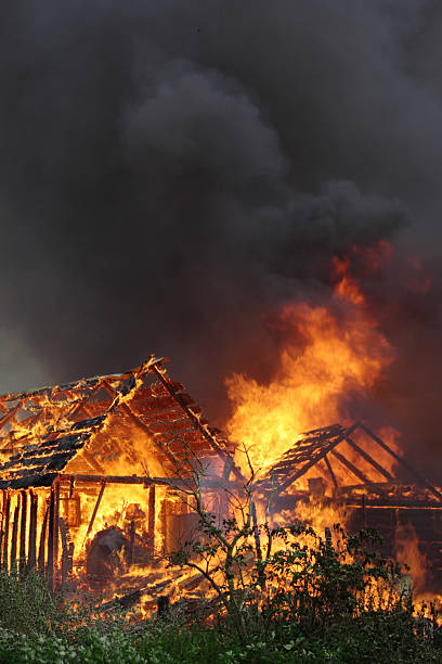 Burning wooden house stock photo