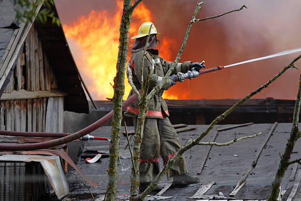 Firefighter on the roof stock photo