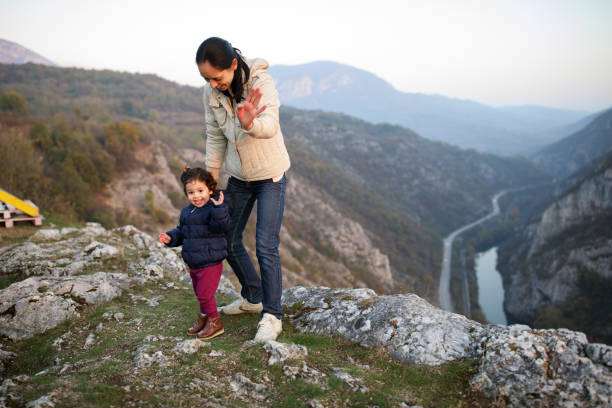 istock Mother and daughter on mountain top 914000034