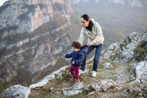 istock Mother and daughter on mountain top 914000134