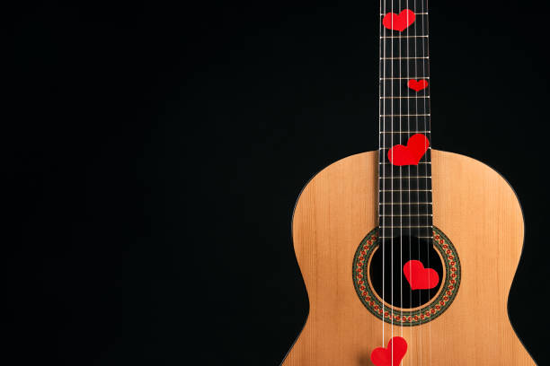 istock Red hearts on the strings of a guitar 914002694