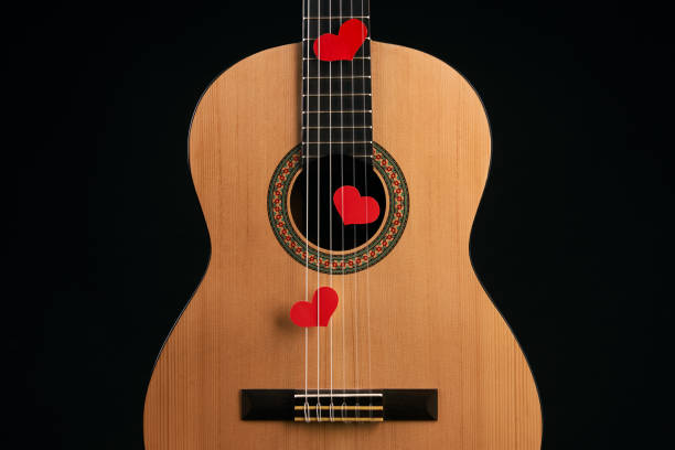istock Red hearts on the strings of a guitar 914002744