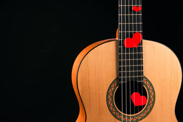 istock Red hearts on the strings of a guitar 914002950