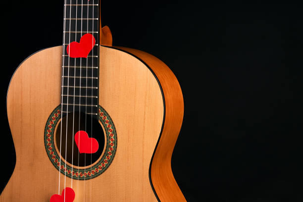 istock Red hearts on the strings of a guitar 914003034