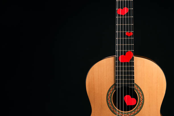 istock Red hearts on the strings of a guitar 914003044