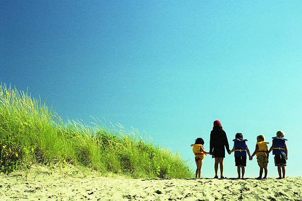 Children at the beach stock photo