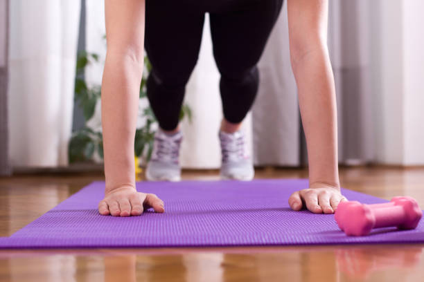 istock Girl doing pushups at home 914006502
