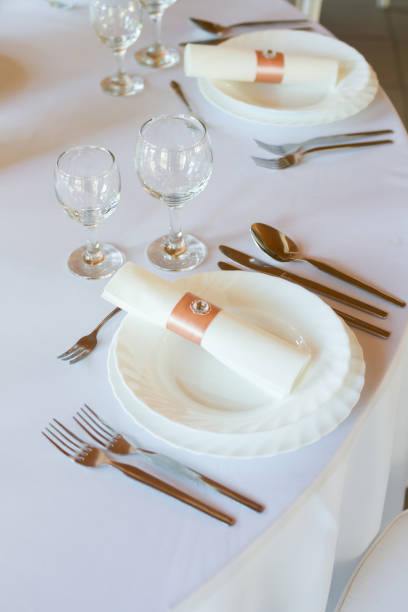 istock table setting with spoon, knife, plates and glass 914007424
