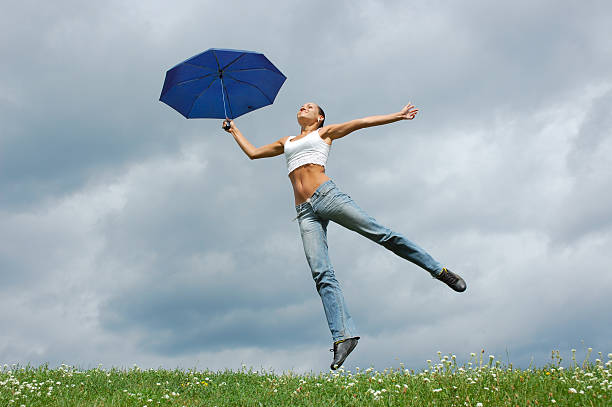 istock Jumping girl with an umbrella 91400884