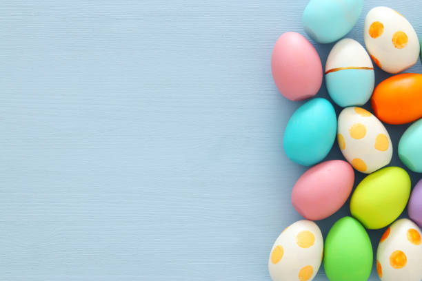 istock Top view of easter colorful eggs over blue background. 914011458