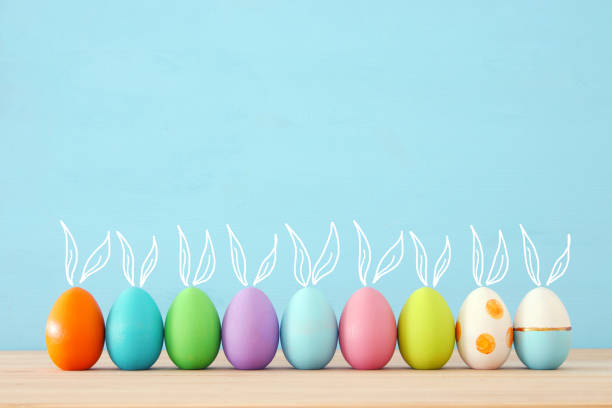 istock Top view of easter colorful eggs over blue background 914011494