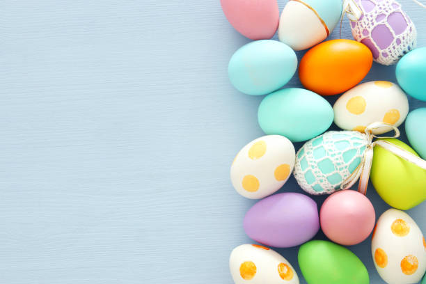 istock Top view of easter colorful eggs over blue background. 914011710