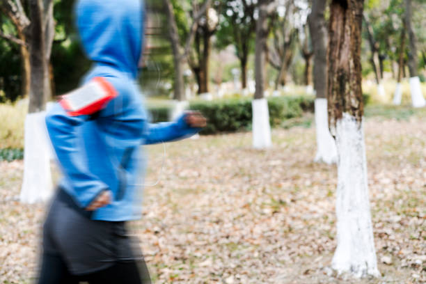 istock young female running in park 914014432