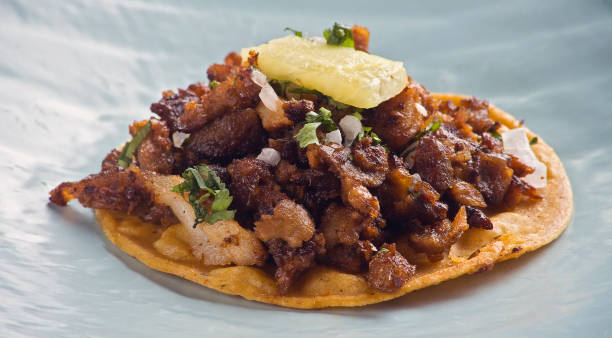 One mexican taco al pastor One mexican taco al pastor close up mexican food photos stock pictures, royalty-free photos & images