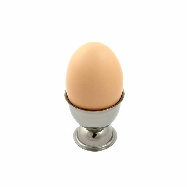 egg in a cup stock photo
