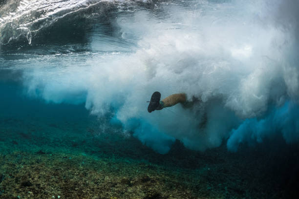 istock Lady surfer in wipe out 914015900