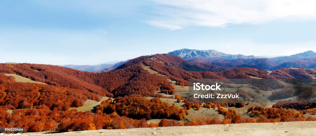 View from mountain Photo is taken from Olympic mountain Bjelasnica during autumn, with view towards west. Road over mountain range is visible in distance. Mountain Prenj in background. Bosnia and Herzegovina Stock Photo