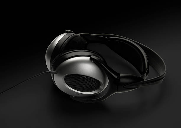 istock Headphones, isolated on black background 91402586