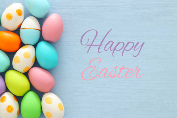 istock Top view of easter colorful eggs over blue background. 914030048