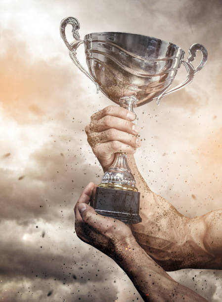istock Cropped male arms with winner cup. 914034118