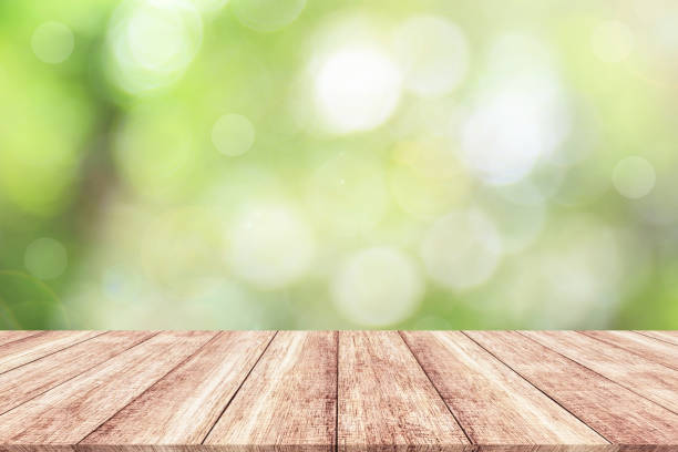 istock Wood table top on blur nature background with spring or summer 914034212