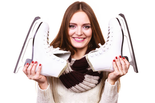 istock Smiling woman with ice skates 914035666
