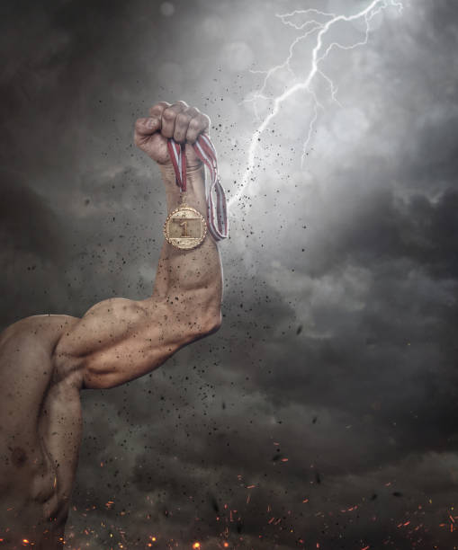 istock Cropped male's arm with gold medal. 914038492