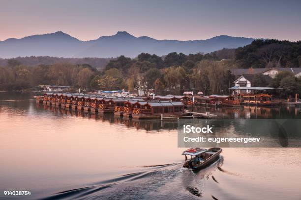 Chinese Evening Landscape With Fishing Boat Stock Photo - Download Image Now - Adulation, Asia, Autumn